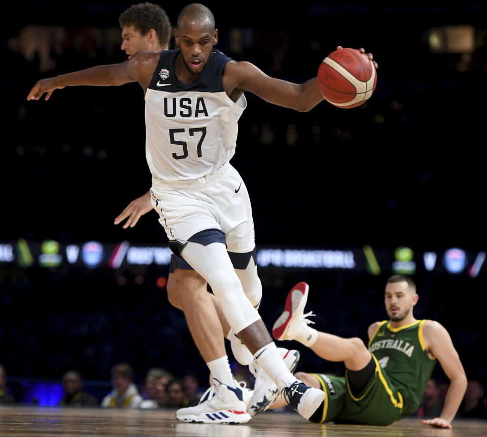 United States' Khris Middleton dribbles past during their exhibition basketball game against Australia in Melbourne, Thursday, Aug. 22, 2019. (AP Photo/Andy Brownbill)