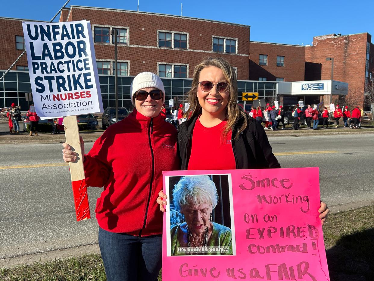 Registered nurses Jillian LeBlanc and Colleen Waucaush pose while on strike on Monday, April 15, 2024 outside of MyMichigan Medical Center Sault.