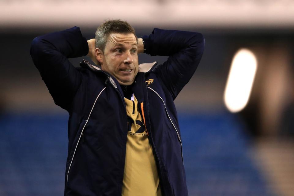 Millwall manager Neil Harris watches his side beat Bournemouth 3-0 in round 3