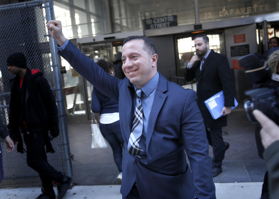 FILE - Johnny Hincapie raises his fist as he leaves the courthouse in New York, Jan. 25, 2017. Attorneys for Hincapie confirmed Friday, Dec. 2, 2022, that Hincapie, a man who was freed in 2015 after spending a quarter-century in prison for an infamous tourist killing, will receive nearly $18 million in legal settlements from the city and state of New York. (AP Photo/Seth Wenig, File)