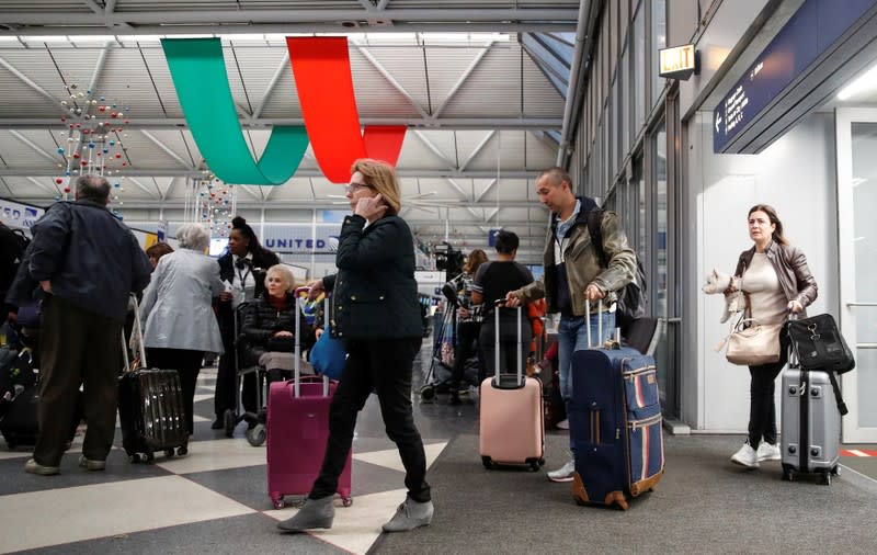 Travelers queue during the Thanksgiving holiday travel rush at O'Hare Airport in Chicago