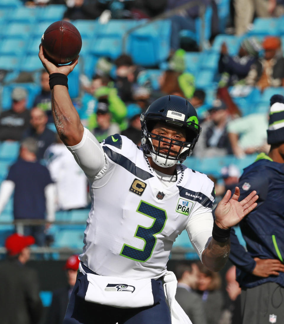 Seattle Seahawks' Russell Wilson (3) warms up before an NFL football game against the Carolina Panthers in Charlotte, N.C., Sunday, Nov. 25, 2018. (AP Photo/Jason E. Miczek)