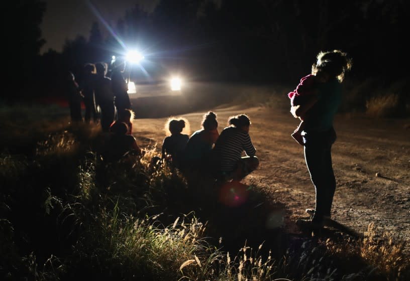 U.S. Border Patrol agents arrive to detain a group of Central American asylum seekers near the U.S.-Mexico border.