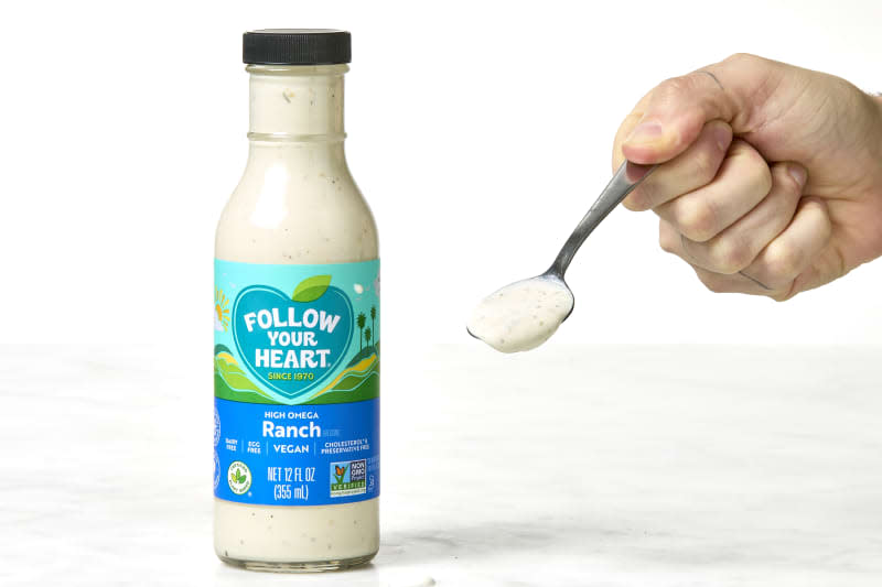 shot of follow your heart vegan ranch in a bottle and on a spoon.