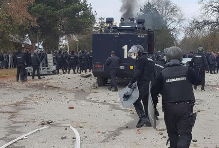 Bulgarian riot police are seen inside a refugee center during clashes in the town of Harmanli, Bulgaria, November 24, 2016. bTV news/Maria Georgieva/via REUTERS