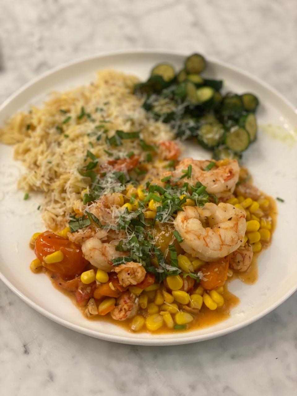 Shrimp and corn stir-fry with tomatoes.