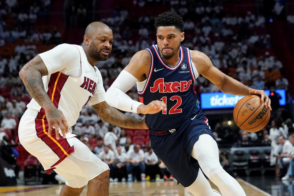 The Heat's P.J. Tucker, left, defends against the Sixers' Tobias Harris.