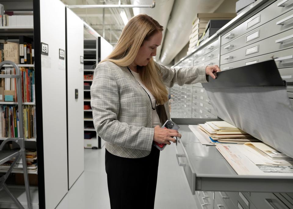 Sept. 15, 2023; Columbus, Oh., USA;  Jenny Robb, head curator of comics and cartoon art at the Billy Ireland Cartoon Library & Museum at Ohio State University, looks through a drawer of archives. 