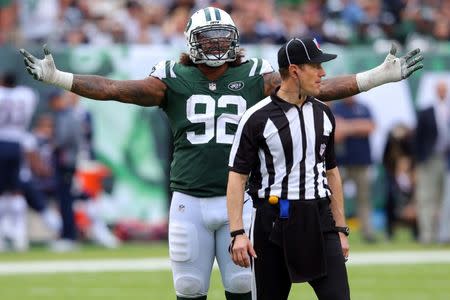 Oct 15, 2017; East Rutherford, NJ, USA; New York Jets defensive end Leonard Williams (92) reacts after a Jets touchdown against the New England Patriots was overturned and changed to a touchback after replay during the fourth quarter at MetLife Stadium. Mandatory Credit: Brad Penner-USA TODAY Sports