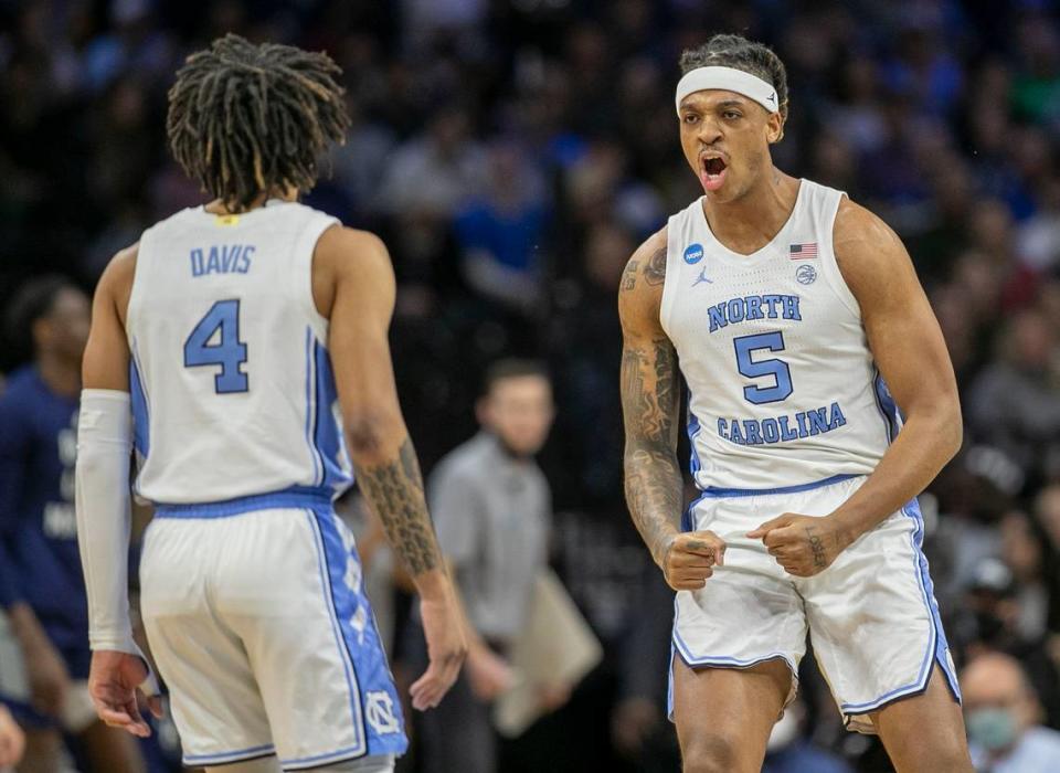 North Carolinas Armando Bacot (5) and R.J. Davis (4) react after securing a lead over Saint Peters in the first half during the NCAA East Regional final on Sunday, March 27, 2022 at Wells Fargo Center in Philadelphia, Pa.