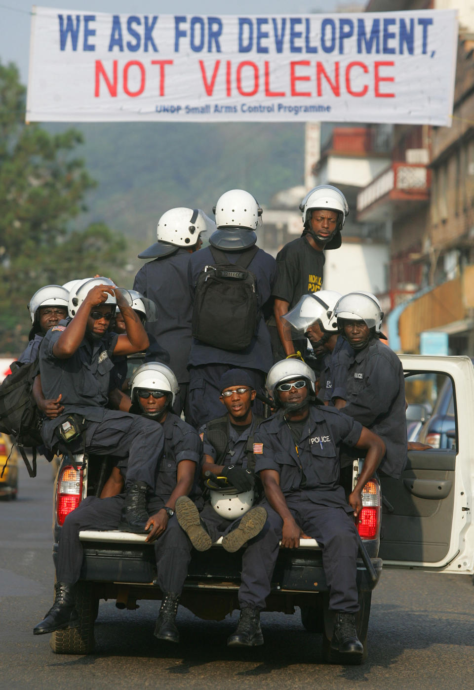 FILE - Liberian Security forces patrol downtown Monrovia, Liberia, Jan. 15, 2006. Liberia is celebrating two major anniversaries this year — 200 years ago freed slaves from the U.S. arrived here and 25 years later they declared the country to be independent. Amid the festivities for Independence Day on Tuesday July 26, 2022, many Liberians say the West African country's promise is unfulfilled and too many of its people still live in poverty. (AP Photo/Jerome Delay, File)