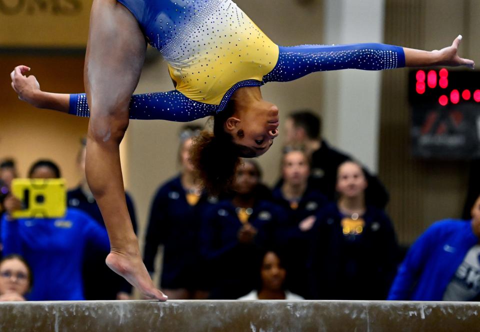 Fisk University gymnast Aliyah Reed-Hammon competes on the balance beam during the Tennessee Collegiate Classic meet Friday, Jan. 20, 2023, in Lebanon, Tenn. Reed-Hammon placed second in the balance bean event with a score of 9.925.