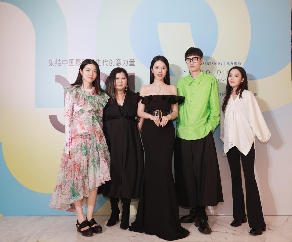 Yu (center) with last season’s Yu Prize finalists. From left: Susan Fang, Huang Wanbing, Chen Peng, and Chen Danqi. - Credit: Courtesy