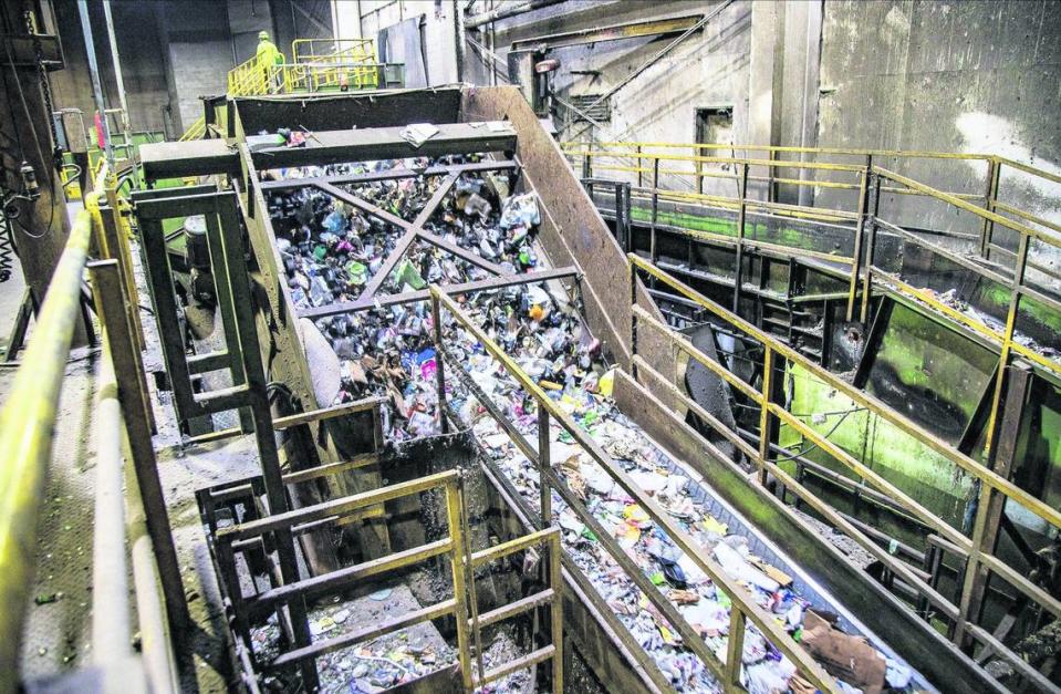 View of recycled materials traveling along a conveyor to be sorted at the Waste Management Recycling Plant located at 20701 Pembroke Road in Pembroke Pines, Florida, on Friday, April 8, 2022.