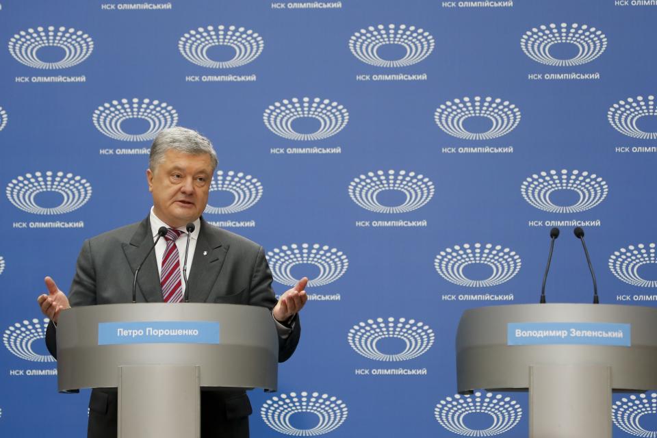 Ukrainian President Petro Poroshenko gestures as he answers to a journalist's question ahead of the presidential elections on April 21, at the Olympic stadium in Kiev, Ukraine, Sunday, April 14, 2019. (AP Photo/Efrem Lukatsky)