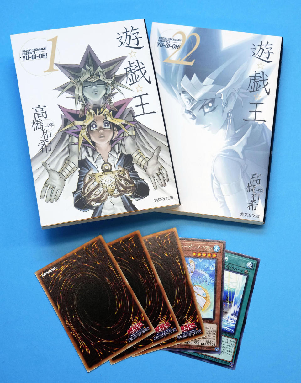 This photo shows “Yu-Gi-Oh!” manga comic and trading cards in Tokyo Thursday, July 7, 2022. Kazuki Takahashi, the creator of the “Yu-Gi-Oh!” manga comic and trading card game, has died, apparently while snorkeling in southwestern Japan, the coast guard said Friday, July 8, 2022. (Shohei Miyano/Kyodo News via AP)
