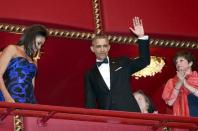 U.S. President Barack Obama and first lady Michelle Obama (L) attend the Kennedy Center Honors at the Kennedy Center in Washington December 6, 2015. REUTERS/Yuri Gripas