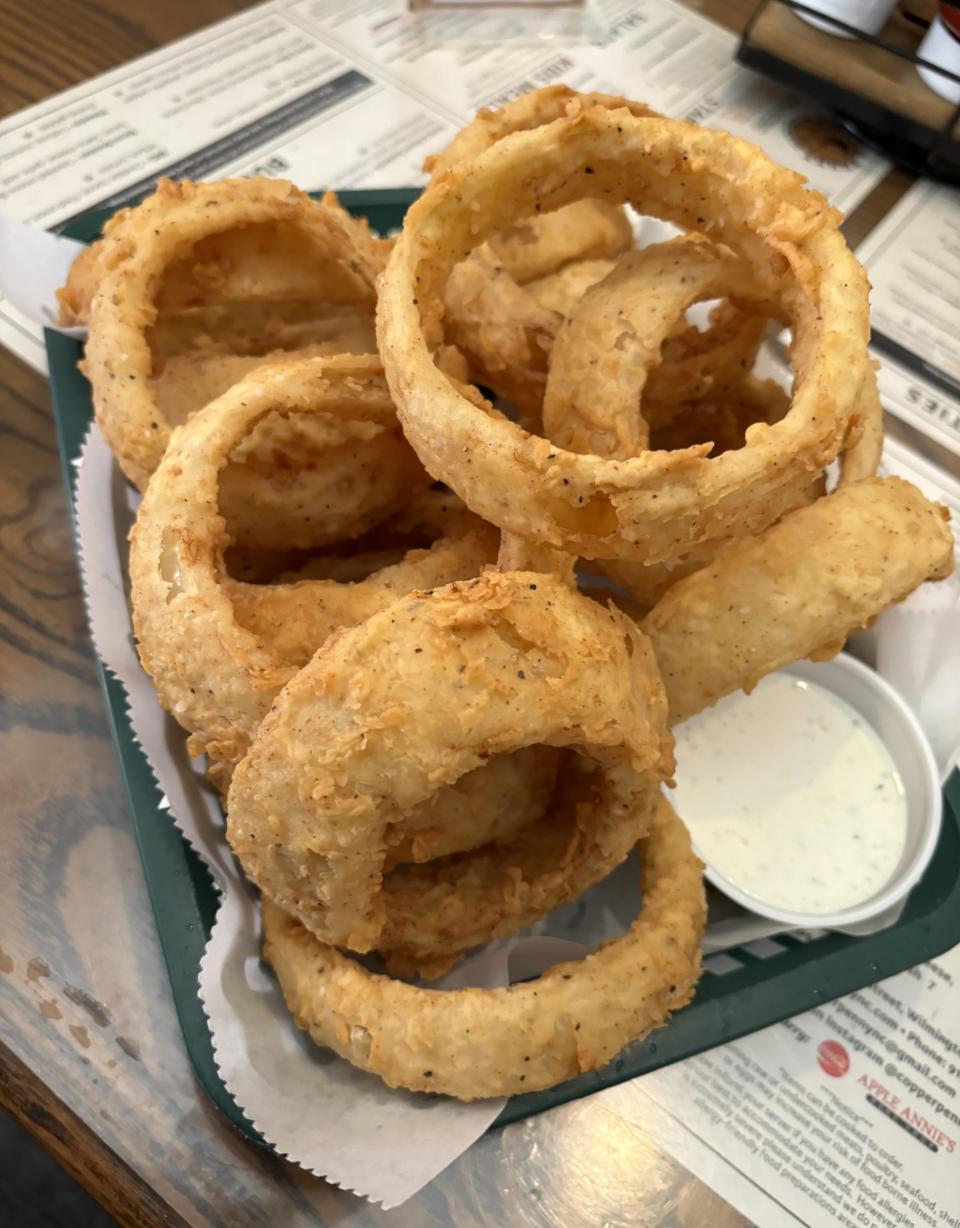 The popular Beer Battered Onion Rings at The Copper Penny at 109 Chestnut St. in Wilmington, N.C. were once featured on Diners, Drive-Ins and Dives on the Food Network.