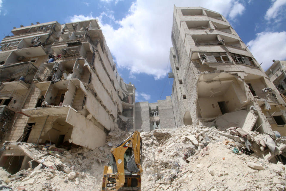 Front loader operates at site hit by airstrikes