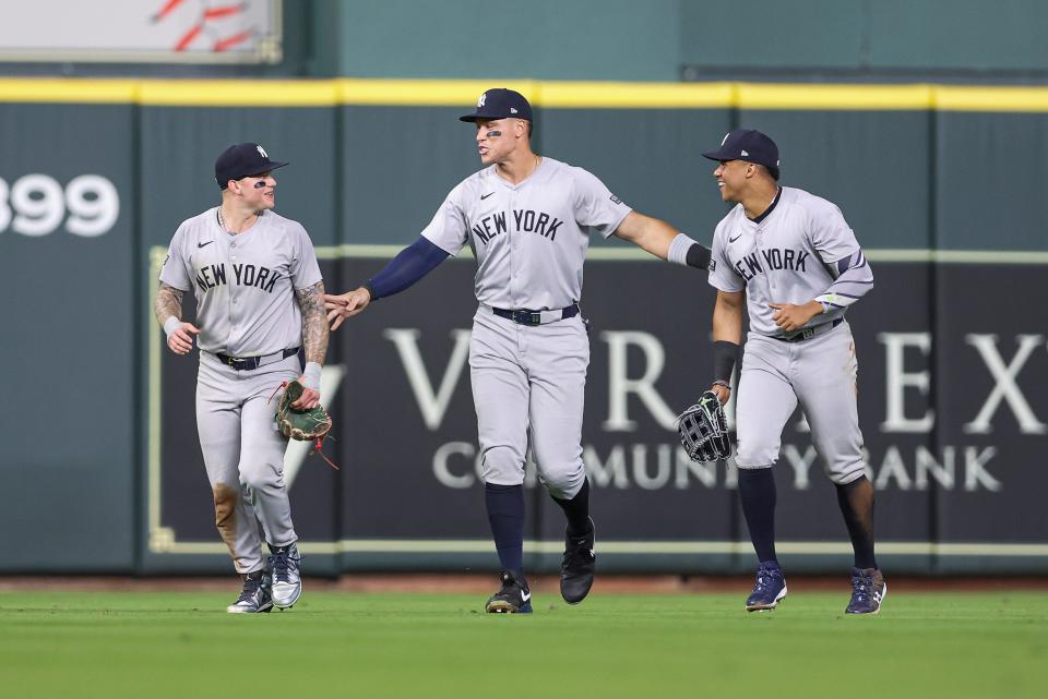 Mar 29, 2024; Houston, Texas, USA; New York Yankees center fielder Aaron Judge (99) celebrates with left fielder Alex Verdugo (24) and right fielder Juan Soto (22) after the game against the Houston Astros at Minute Maid Park. Mandatory Credit: Troy Taormina-USA TODAY Sports