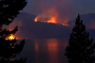 <p>A wildfire burns off the shore of Jackson Lake in Grand Teton National Park, Wyo., Aug 26, 2016. (AP Photo/Brennan Linsley) </p>