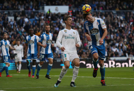 Soccer Football - La Liga Santander - Real Madrid vs Deportivo La Coruna - Santiago Bernabeu, Madrid, Spain - January 21, 2018. Deportivo de La Coruna's Fabian Schar in action with Real Madrid’s Cristiano Ronaldo. REUTERS/Sergio Perez