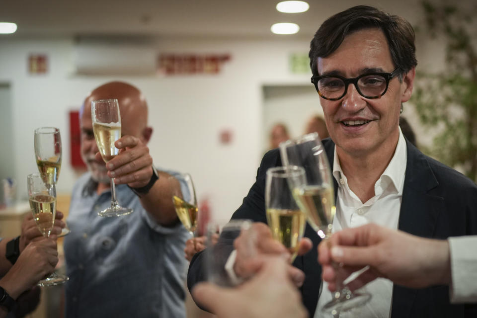 Socialist candidate Salvador Illa makes a toast with members of his team and party colleagues after the announcement of the results of elections to the Catalan parliament in Barcelona, Sunday May 12, 2024. The Socialists led by former health minister Illa won a majority of 42 seats, up from their 33 seats in 2021 when they also barely won the most votes but were unable to form a government. They will still need to earn the backing of other parties to put Illa in charge.(AP Photo/Emilio Morenatti)