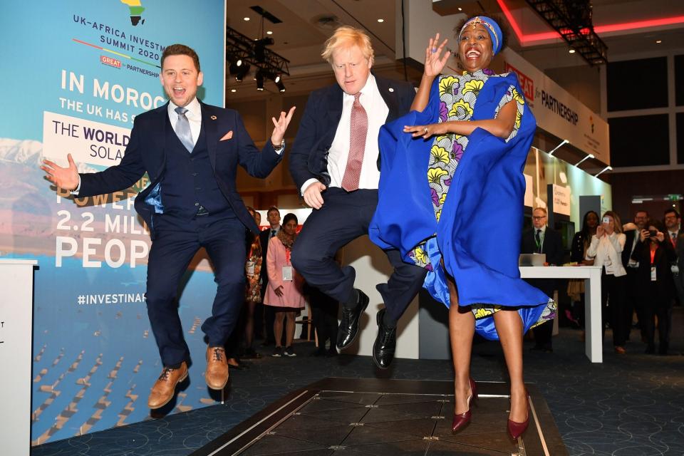 Prime Minister Boris Johnson visits the Pavegen stand, a company that converts footsteps into energy (PA)