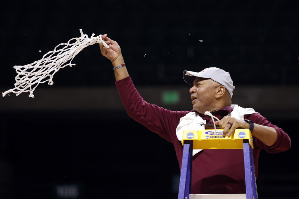 Texas Southern head coach Johnny Jones celebrates after cutting down the net after defeating Grambling State in an NCAA college basketball game in the championship of the Southwestern Athletic Conference tournament, Saturday, March 11, 2023, in Birmingham, Ala. (AP Photo/Butch Dill)