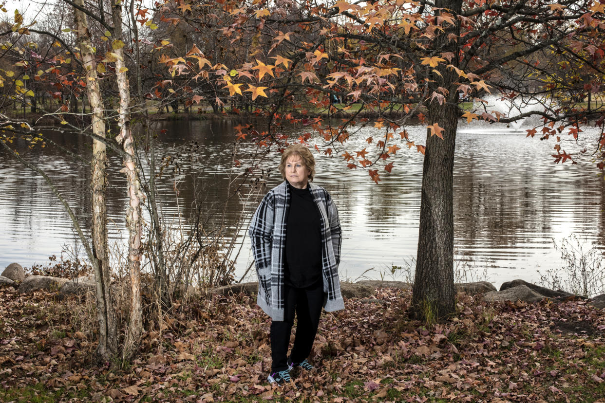 Gail Lawson, who faced more than $100,000 in bills after a complex surgery when her UnitedHealthcare insurance paid out just $5,449.27, at a park in Westwood, N.J., Nov. 17, 2023. (Bryan Anselm/The New York Times)