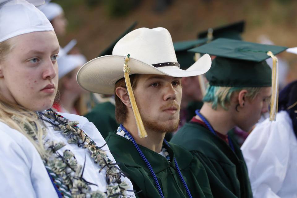 Quentin Smith wears his cowboy hat with tassel at the graduation ceremonies at Paradise High School in Paradise, Calif., Thursday June 6, 2019. Most of the students of Paradise High lost their homes when the Camp Fire swept through the area and the school was forced to hold classes in Chico. The seniors gathered one more time at Paradise High for graduation ceremonies. (AP Photo/Rich Pedroncelli)