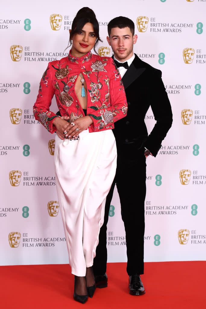 <p>The couple walked their first red carpet in over a year due to Covid restrictions as they graced the Royal Albert Hall with their presence for the 2021 BAFTA awards, where Chopra was presenting an award. </p><p>On the red carpet, the White Tiger actress wore a Pertegaz shirt and trousers accessorised with a blue tasseled Bulgari necklace and Christian Louboutin shoes.</p><p>The star later changed into a Ronald Vanderkemp silk jacket and plisse skirt to present.</p>