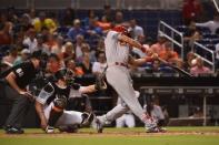 Aug 7, 2018; Miami, FL, USA; St. Louis Cardinals first baseman Matt Carpenter (13) connects for a solo home run in the eighth inning against the Miami Marlins at Marlins Park. Jasen Vinlove-USA TODAY Sports