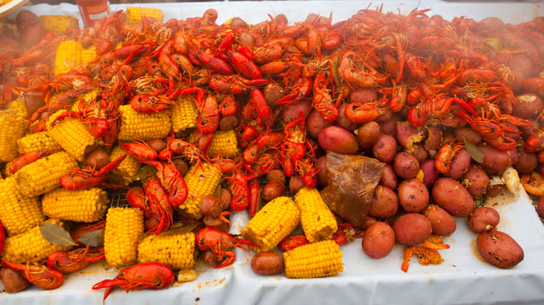 crawfish and corn on table