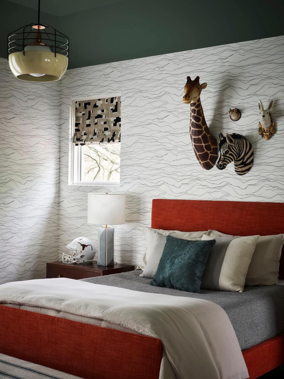 In this boy’s room, papier-mâché animal mounts from Nickey Kehoe keep the vibe childlike. The custom linen-upholstered bed, on the other hand, could last well into his teenage years.