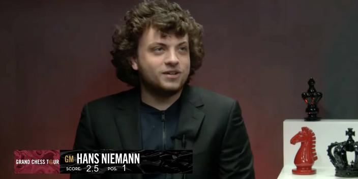 A screenshot shows Hans Niemann smiling during an interview.