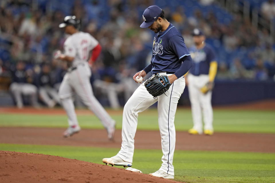 Tampa Bay Rays starting pitcher Taj Bradley reacts after Boston Red Sox's Rafael Devers runs around the bases after his two-run home run during the fourth inning of a baseball game Monday, May 20, 2024, in St. Petersburg, Fla. (AP Photo/Chris O'Meara)
