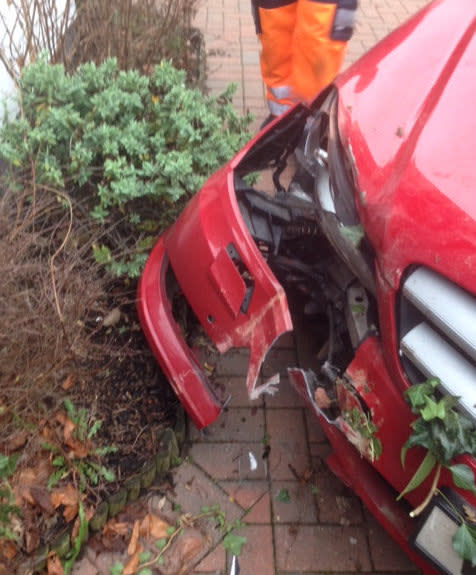 The Mercedes was shunted into the corner of the house (Picture: SWNS)