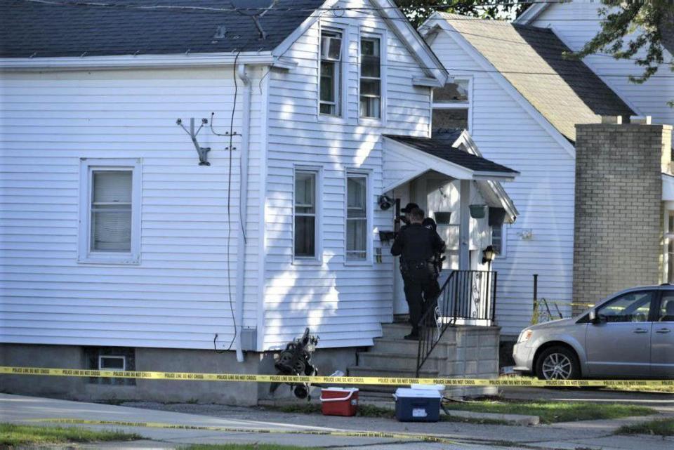 Kenosha Police Officers collect evidence Wednesday, Oct. 20, 2021, at the scene of a triple homicide that happened late Tuesday night in Kenosha, Wis. (Pete Wicklund/The Kenosha News via AP)