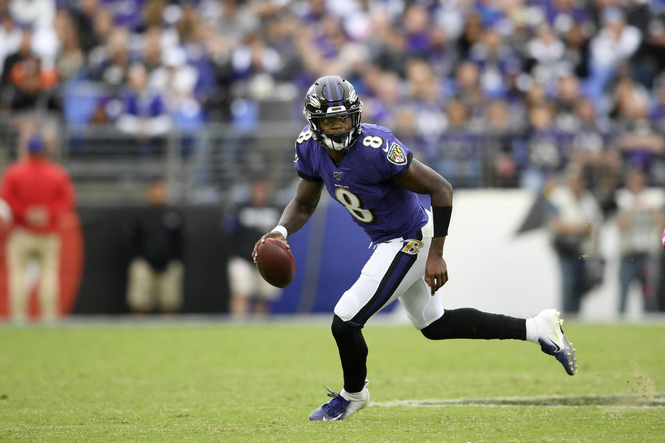 Baltimore Ravens quarterback Lamar Jackson scrambles against the Cincinnati Bengals during the second half of a NFL football game Sunday, Oct. 13, 2019, in Baltimore. (AP Photo/Nick Wass)