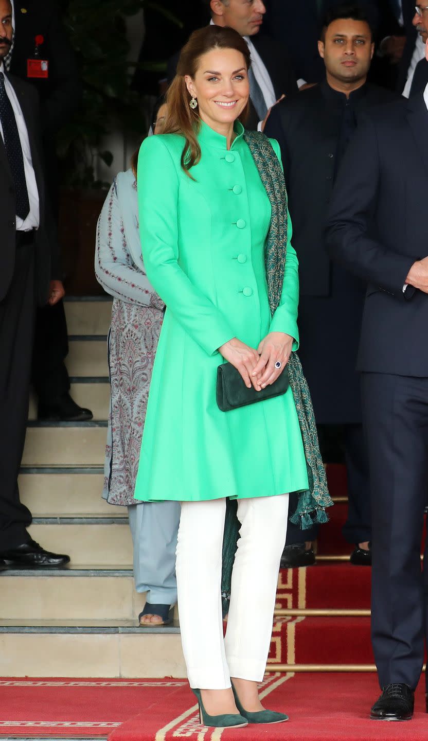 <p>When meeting with Prime Minister Imran Khan, Kate wore a vibrant green tunic by Catherine Walker over trousers by Maheen Kahn, a look which she paired with a scarf by Satringi and earrings by Zeen.</p>