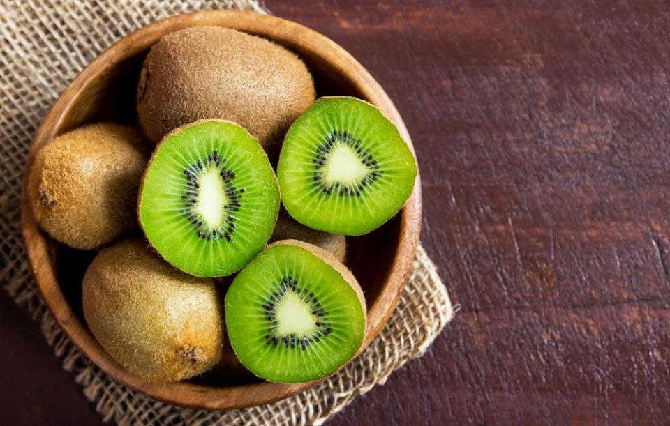 <p>Kiwi is rich in amino acids and <a href="https://www.goodhousekeeping.com/beauty/anti-aging/g26840895/best-vitamin-c-serums/" rel="nofollow noopener" target="_blank" data-ylk="slk:vitamin C;elm:context_link;itc:0;sec:content-canvas" class="link ">vitamin C</a>, both of which help reduce excess production of oil in skin. In addition to being a cooking staple, <a href="https://www.goodhousekeeping.com/food-products/g4846/top-olive-oil-reviews/" rel="nofollow noopener" target="_blank" data-ylk="slk:olive oil;elm:context_link;itc:0;sec:content-canvas" class="link ">olive oil</a> contains strong antibacterial properties and actually helps stop the skin from secreting excess sebum, Balensi says. Plus, brown sugar sloughs off dead skin cells and hydrates, which (bonus!) gives your skin a healthy <a href="https://www.goodhousekeeping.com/beauty/anti-aging/a28541767/how-to-get-glowing-skin-tips/" rel="nofollow noopener" target="_blank" data-ylk="slk:glow;elm:context_link;itc:0;sec:content-canvas" class="link ">glow</a>.</p><p><strong>Recipe:<br></strong>1 whole kiwi (peeled and mashed)<br>2 tsp brown sugar <br>A few drops of olive oil </p><p>Stir all the ingredients together, mixing well. Gently rub the scrub onto skin in a circular motion for three to five minutes. Remove with warm water. </p>