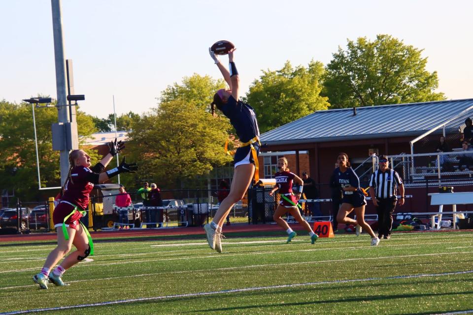 Webster Thomas' Catherine Rogers grabs a pass at Greece Arcadia during the 2023 Section V Girls Flag Football season.