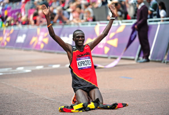 LONDON, ENGLAND - AUGUST 12: Stephen Kiprotich of Uganda celebrates winning gold in the Men's Marathon on Day 16 of the London 2012 Olympic Games at The Mall on August 12, 2012 in London, England. (Photo by Stu Forster/Getty Images)