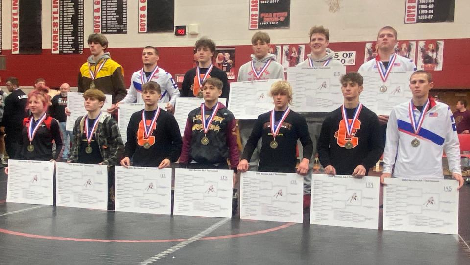 Pictured are the 13 champions from the District 10 Class 2A Section 1 individual wrestling championships. Fort LeBoeuf won the team title with 221.5 points.