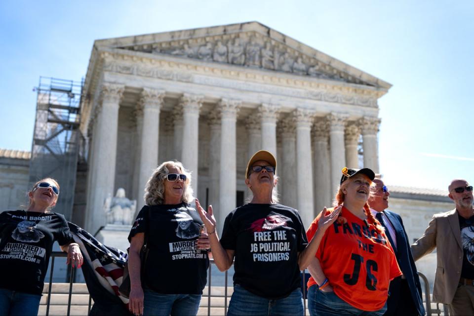 Supporters of January 6 defendants including Micki Witthoeft, the mother of Ashli Babbitt, sing “God Boss the USA” outside of the Supreme Court on April 16. Now, the court has put some of the Jan. 6 riot convictions in question (Getty Images)