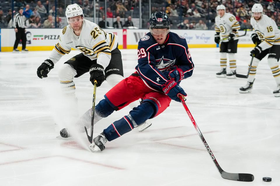 Nov 27, 2023; Columbus, Ohio, USA; Columbus Blue Jackets right wing Patrik Laine (29) skates around Boston Bruins defenseman Brandon Carlo (25) during the third period of the NHL game at Nationwide Arena. The Blue Jackets won 5-2.