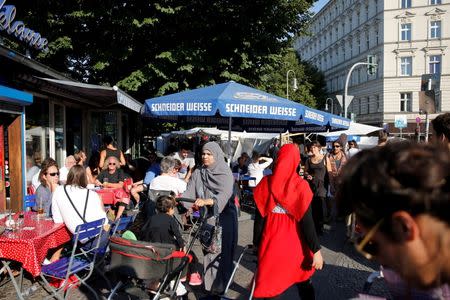 People visit a market in Berlin's Kreuzberg district, Germany, August 19, 2016. REUTERS/Axel Schmidt