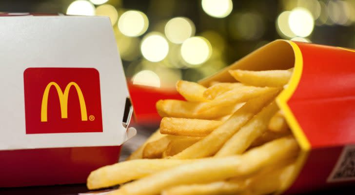 A McDonald's (MCD) burger box and fries rest on a flat surface.