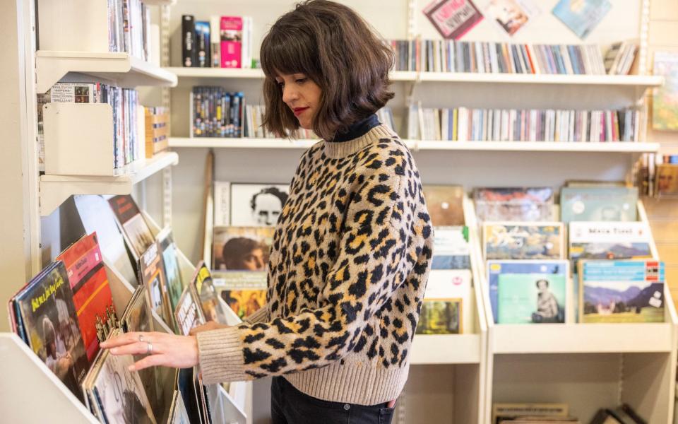 Fiona Cowood rummaging in her local Oxfam charity shop - Heathcliff O'Malley